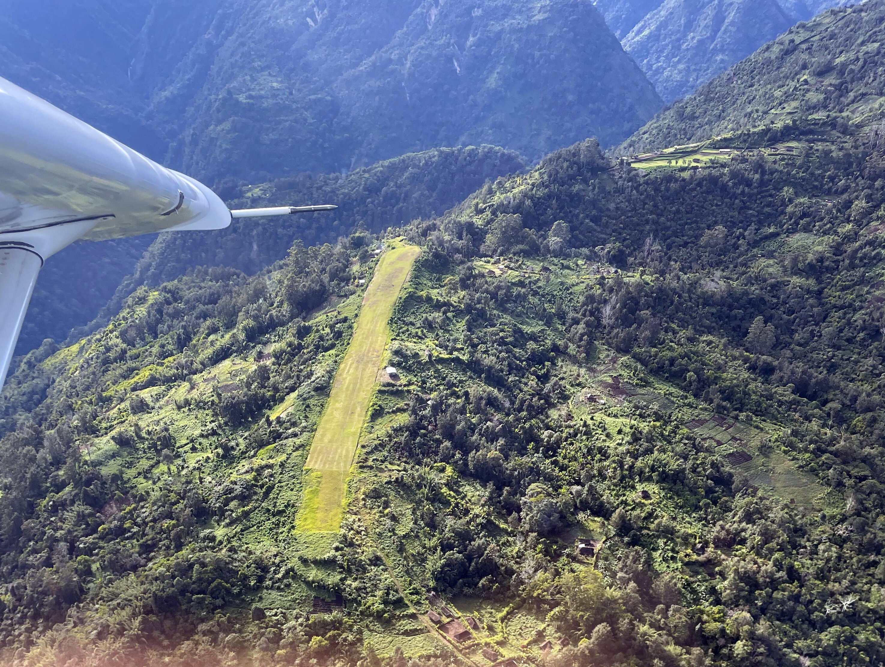 A runway in Papua New Guinea, the Pacific rainforest in the Green Band